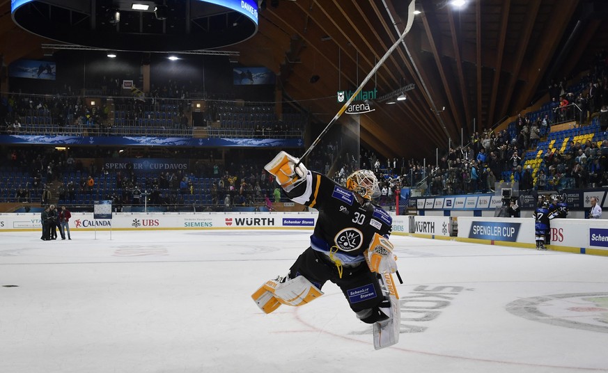 epa05688760 Lugano&#039;s goalkeeper Elvis Merzlikins celebrates after the game between HC Lugano and Avtomobilist Yekaterinburg, at the 90th Spengler Cup ice hockey tournament in Davos, Switzerland,  ...