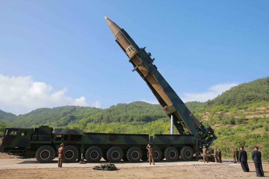 epa06064781 A handout photo made available by the official North Korean Central News Agency (KCNA) allegedly shows the North Korean inter-continental ballistic rocket Hwasong-14 being prepared before  ...