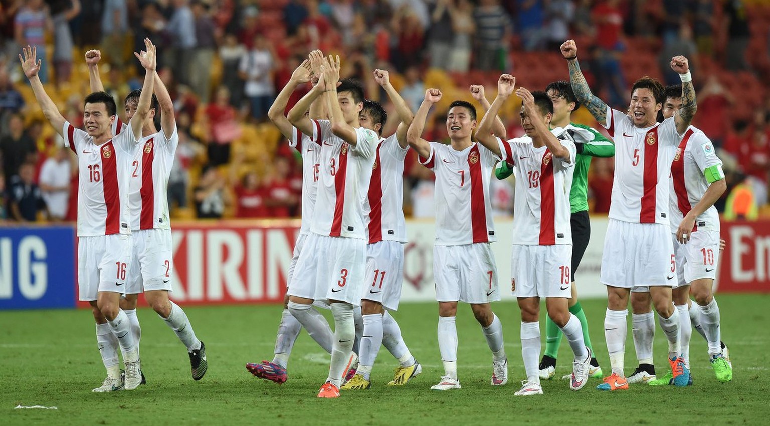 epa04559492 Chinese players celebrate following the Group B Asian Cup match between Uzbekistan and the People&#039;s Republic of China at Brisbane Stadium in Brisbane, Australia, 14 January 2015. EPA/ ...