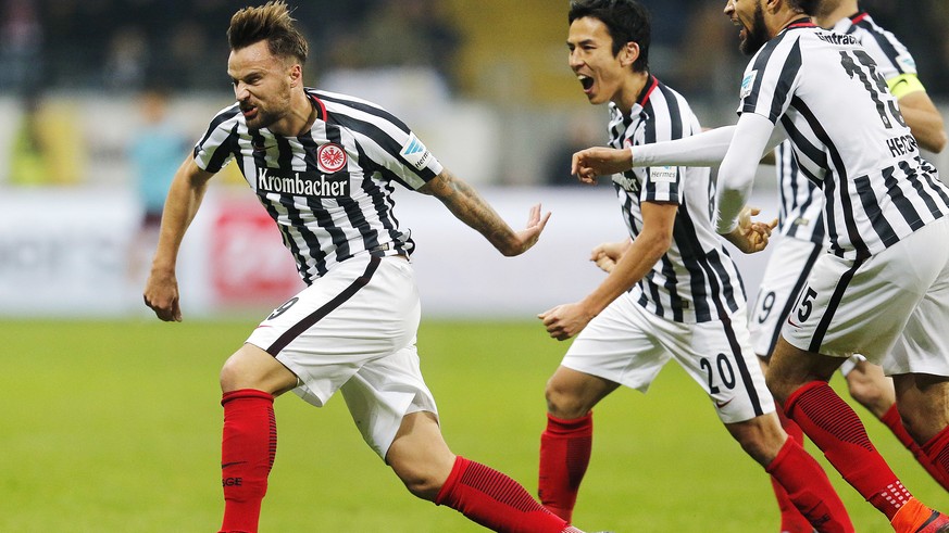 Frankfurt&#039;s Haris Seferovic, left, celebrates his side&#039;s second goal during a German first division Bundesliga soccer match between Eintracht Frankfurt and Borussia Dortmund in Frankfurt, Ge ...