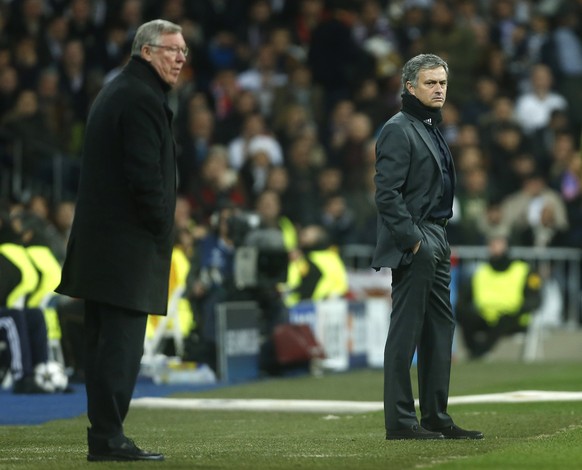 FILE- In this Wednesday Feb. 13, 2013 file photo, the then Manchester United&#039;s manager Sir Alex Ferguson, left, and Real Madrid&#039;s coach Jose Mourinho stand on the touchline during the Champi ...
