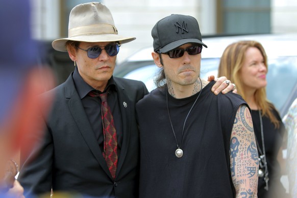 Actor Johnny Depp, left, stands with former Arkansas death row inmate Damien Echols, before speaking at a rally opposing Arkansas&#039; upcoming executions, which are set to begin next week, on the fr ...