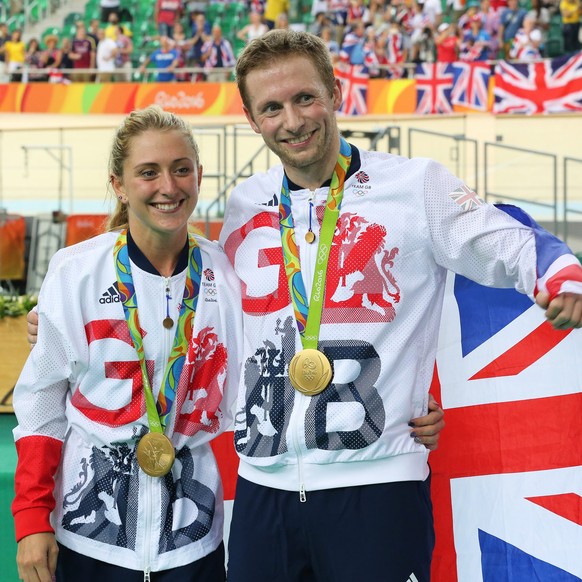 epa05491284 Jason Kenny (R) of Britain poses with Laura Trott (L) after winning the gold medal the men&#039;s Keirin final of the Rio 2016 Olympic Games Track Cycling events at the Rio Olympic Velodro ...