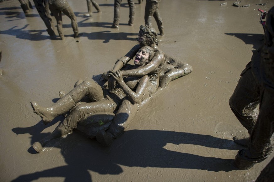 Festivalvisitors dancing in the mud during the OpenAir St. Gallen on Sunday, June 30, 2013, in St. Gallen. The OpenAir St.Gallen is one of the oldest outdoor festivals in Switzerland. It's close ...