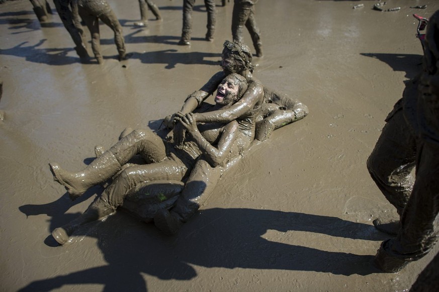 Festivalvisitors dancing in the mud during the OpenAir St. Gallen on Sunday, June 30, 2013, in St. Gallen. The OpenAir St.Gallen is one of the oldest outdoor festivals in Switzerland. It&#039;s close  ...