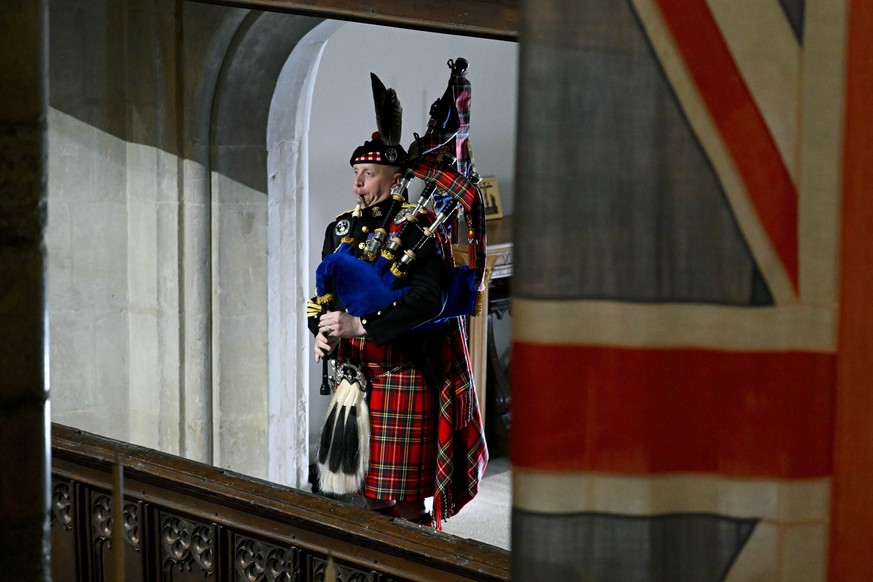 Pipe Major Paul Burns of the Royal Regiment of Scotland helps to close the State Funeral of Queen Elizabeth II with a rendition of the traditional piece Sleep, Dearie, Sleep at Westminster Abbey, in L ...