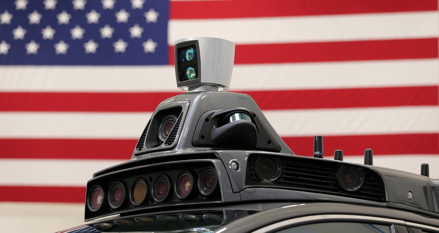 A roof mounted camera and radar system is shown on Uber&#039;s Ford Fusion self driving car during a demonstration of self-driving automotive technology in Pittsburgh, Pennsylvania, U.S. September 13, ...