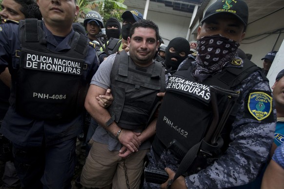 epa04497468 Honduran Police officers detain Plutarco Antonio Ruiz Rodriguez, alleged murderer of Honduran Beauty Queen and Miss World Honduras Maria Jose Alvarado and her sister Sofia Trinidad, as the ...