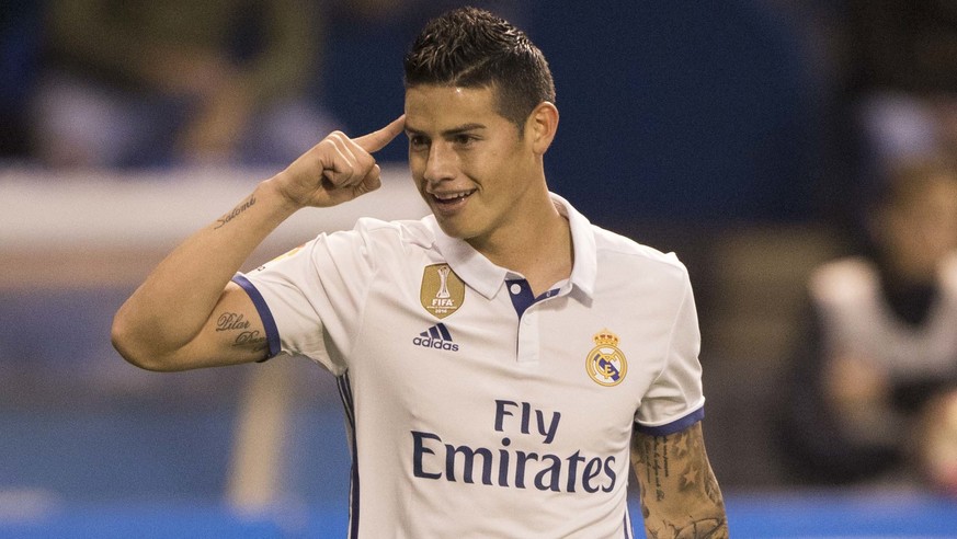 Real Madrid&#039;s James Rodriguez reacts after scoring a goal during a Spanish La Liga soccer match between Deportivo La Coruna and Real Madrid at the Riazor stadium in A Coruna, Spain, Wednesday Apr ...