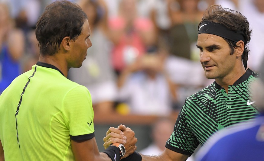 Roger Federer, of Switzerland, right, shakes hands with Rafael Nadal, of Spain, after their match at the BNP Paribas Open tennis tournament, Wednesday, March 15, 2017, in Indian Wells, Calif. Federer  ...