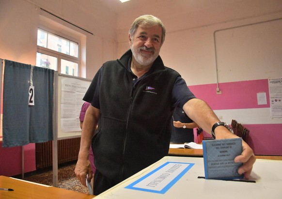 Center-right coalition candidate for mayor in Genoa, Marco Bucci, casts his ballot in a polling station in Genoa, Italy, Sunday, June 25, 2017. Italian towns are holding mayoral runoffs after the firs ...
