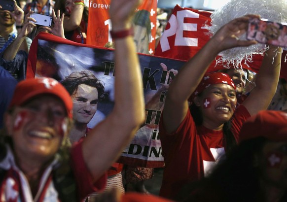 Tennis - Australian Open - Melbourne Park, Melbourne, Australia - early 30/1/17 Supporters of Switzerland&#039;s Roger Federer celebrate after he won his Men&#039;s singles final match against Spain&# ...