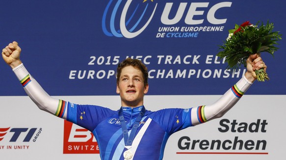 Stefan Kueng from Switzerland celebrates on the podium after winning the Men&#039;s Individual Pursuit Final during the UCI European Track Cycling Championships in Grenchen, Switzerland, Saturday, Oct ...