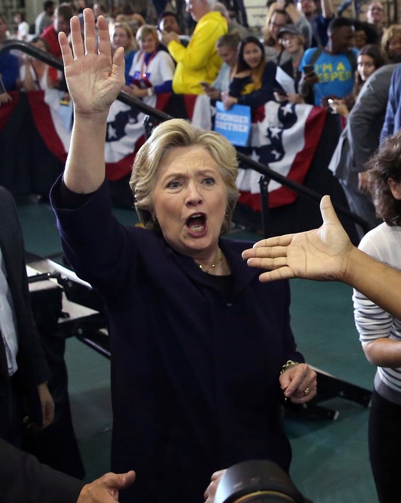 U.S. Democratic presidential nominee Hillary Clinton waves to supporters after speaking at a voter registration rally at Wayne State University in Detroit, Michigan, U.S. October 10, 2016. REUTERS/Luc ...