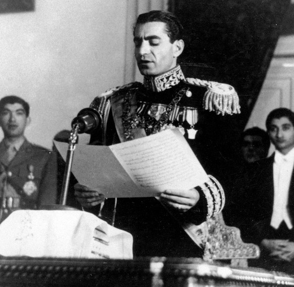 In this Feb. 16, 1950 picture, the Shah of Iran Mohammad Reza Pahlavi reads his inaugural speech at the initial session of his nation&#039;s first senate in Tehran, Iran. The popular revolt against th ...