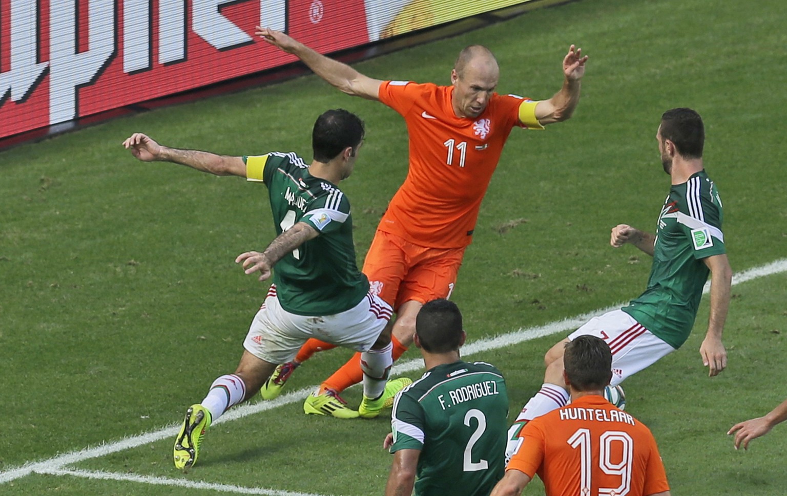 Mexico&#039;s Rafael Marquez, left, fouls Netherlands&#039; Arjen Robben inside the penalty box during the World Cup round of 16 soccer match between the Netherlands and Mexico at the Arena Castelao i ...