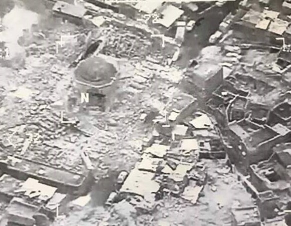 epa06042179 A handout aerial image made available by the Combined Joint Task Force (CJTF) shows the destroyed remains of the Great Mosque of al-Nuri in Western Mosul, Iraq, 21 June 2017. According to  ...