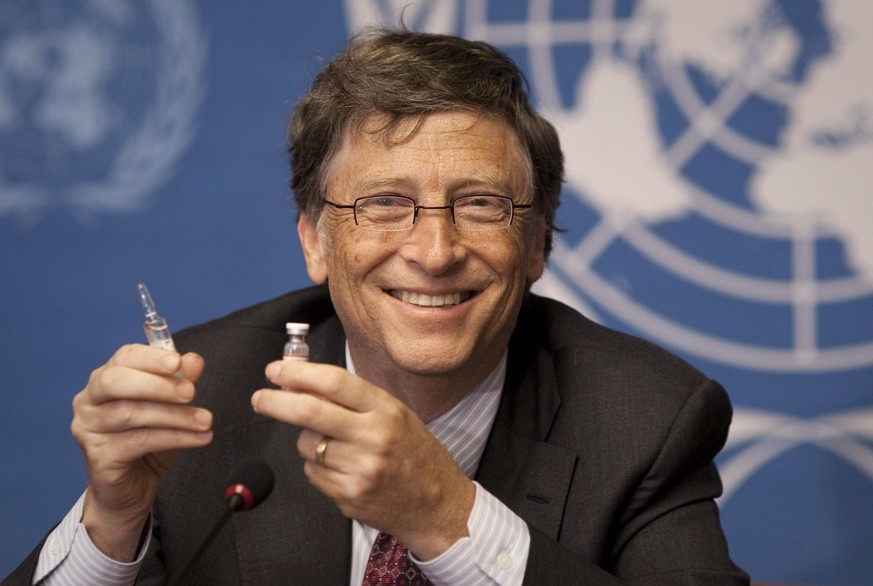 FILE - In this Tuesday, May 17, 2011 file photo, Microsoft founder Bill Gates holds a vaccine for meningitis during a news conference at the United Nations headquarters in Geneva, Switzerland. On Frid ...