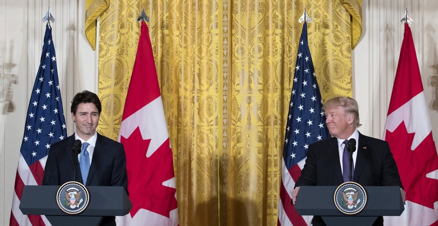 epa05791632 US President Donald J. Trump (R) and Canadian Prime Minister Justin Trudeau (L) participate in a joint press conference in the East Room of the White House in Washington, DC, USA, 13 Febru ...