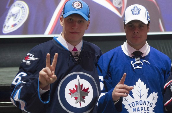 The NHL top three draft picks, Patrik Laine, Winnipeg Jets; Auston Matthews, Toronto Maple Leafs; and Pierre-Luc Dubois, Columbus Blue Jackets, pose for a photo at the NHL hockey draft, Friday, June 2 ...