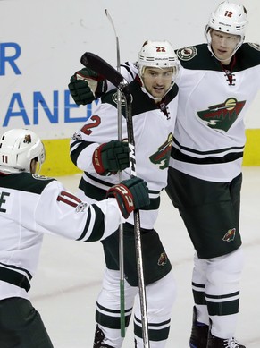 Minnesota Wild center Eric Staal (12) celebrates his goal with teammates Nino Niederreiter (22) and Zach Parise (11) during the third period of an NHL hockey game against the San Jose Sharks Thursday, ...