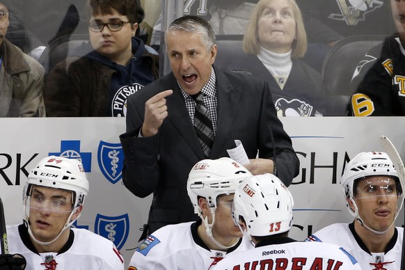 Calgary Flames head coach Bob Hartley gives instructions during the third period of an NHL hockey game against the Pittsburgh Penguins in Pittsburgh, Saturday, March 5, 2016. The Flames won 4-2. (AP P ...