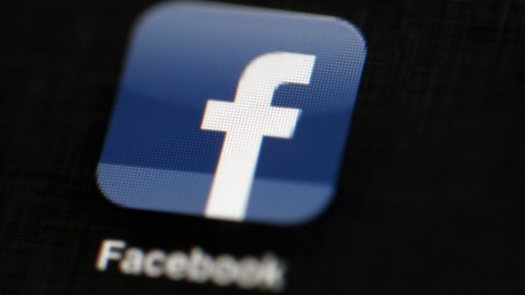 FILE - In this May 16, 2012, file photo, the Facebook logo is displayed on an iPad in Philadelphia. Russia&#039;s communications watchdog has threatened to block access to Facebook next year if the co ...