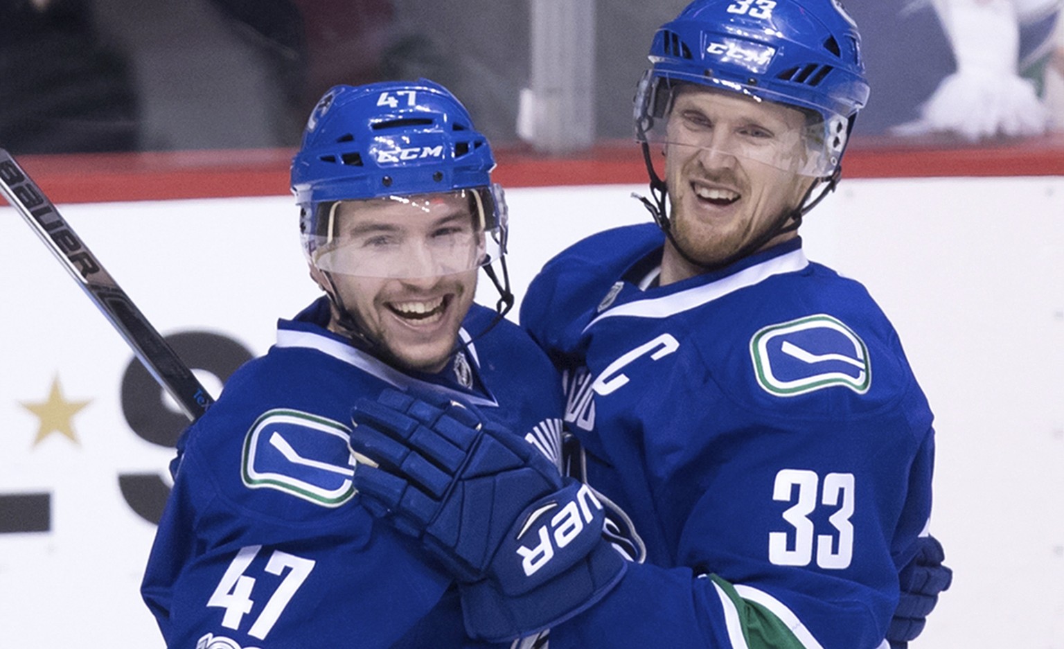 Vancouver Canucks&#039; Sven Baertschi, left, and Henrik Sedin, of Sweden, celebrate Baertschi&#039;s second goal against the Colorado Avalanche during the third period of an NHL hockey game in Vancou ...