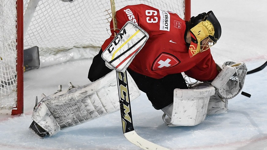 Switzerland’s goaltender Leonardo Genoni saves the puck during the Ice Hockey World Championship group B preliminary round match between Switzerland and France in Paris, France on Tuesday, May 9, 2017 ...