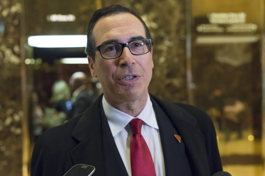 epa05653583 Steven Mnuchin, a contender for the position of Secretary of Treasury of the USA under the administration of US President-elect Donald Trump, speaks to reporters as he arrives at the Trump ...