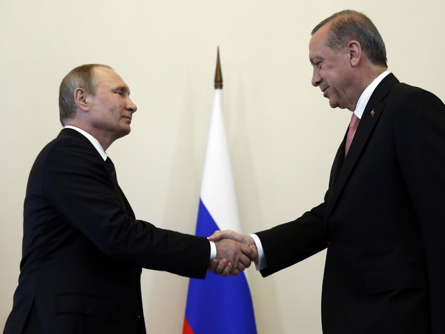 Russian President Vladimir Putin, left, welcomes Turkish President Recep Tayyip Erdogan in the Konstantin palace outside St.Petersburg, Russia, on Tuesday, Aug. 9, 2016. President Erdogan travels to R ...