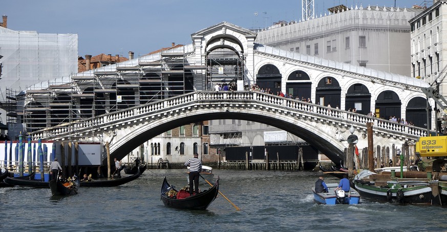 Scaffoldings are seen during the restoration of the Rialto Bridge on the Grand Canal in Venice lagoon April 15, 2015. The ancient Venetian bridge, which has more than 20 million tourists walking on it ...