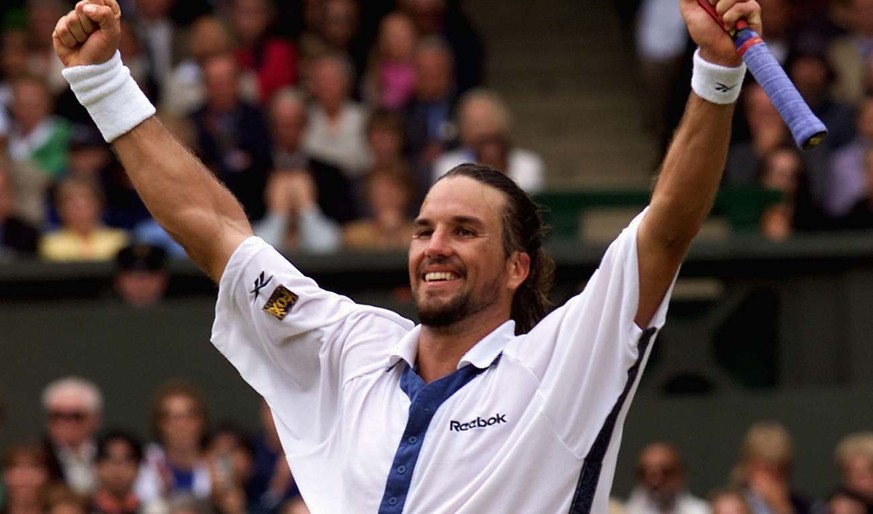 WIM36-20000707-WIMBLEDON, UNITED KINGDOM: Australian Patrick Rafter jubilates after winning his Men&#039;s Singles semi-final match at the Wimbledon 2000 tennis tournament against US player Andre Agas ...