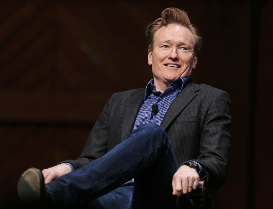 Television host Conan O&#039;Brien smiles towards the audience at Sanders Theatre on the campus of Harvard University in Cambridge, Friday, Feb. 12, 2016. O&#039;Brien, who graduated from the school i ...