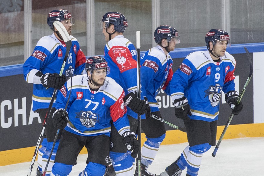 The players from Zug with Robin Grossmann, left, reacts after a goal during the Champions Hockey League group C match between Switzerland&#039;s EV Zug and HK Neman Grodno from Belarus, in Zug, Switze ...