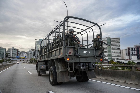 epa05775543 Members of the Brazilian army on a vehicle patrol in Vitoria, Espirito Santo State, Brazil, 06 February 2017. The capital of the southeastern Brazilian state of Espirito Santo has reported ...