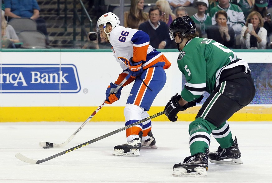 New York Islanders&#039; Joshua Ho-Sang (66) prepares to take a shot as Dallas Stars&#039; Jamie Oleksiak (5) defends in the second period of an NHL hockey game, Thursday, March 2, 2017, in Dallas. (A ...