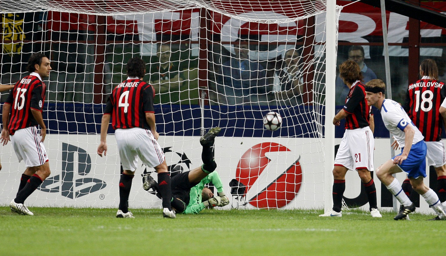 Zurich defender Hannu Tihinen, right in blue shorts, of Finland, scores a goal during the Champions League, group C, soccer match between AC Milan and FC Zurich at the San Siro stadium in Milan, Italy ...