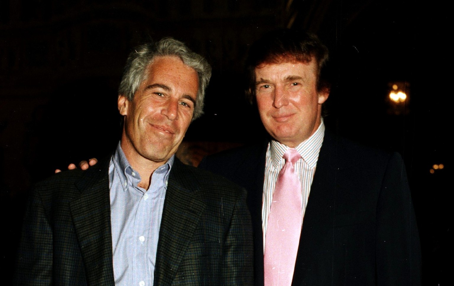 Portrait of American financier Jeffrey Epstein (left) and real estate developer Donald Trump as they pose together at the Mar-a-Lago estate, Palm Beach, Florida on February 22, 1997. (Photo by Davidof ...