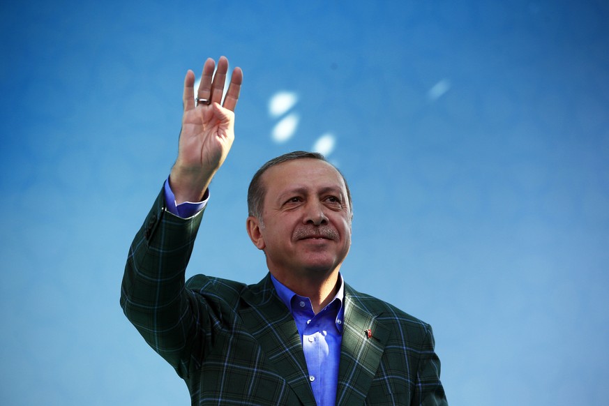 Turkey&#039;s President Recep Tayyip Erdogan waves to supporters during the last rally ahead of Sunday&#039;s referendum, in Istanbul, Saturday, April 15, 2017. Turkey is heading to a contentious refe ...