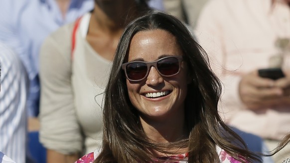 FILE- In this Friday, June 19, 2015 file photo, Pippa Middleton, left, the sister of Kate, the Duchess of Cambridge, watches the quarterfinal tennis match between Canada&#039;s Milos Raonic and France ...