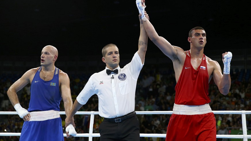 2016 Rio Olympics - Boxing - Final - Men&#039;s Heavy (91kg) Final Bout 220 - Riocentro - Pavilion 6 - Rio de Janeiro, Brazil - 15/08/2016. Evgeny Tishchenko (RUS) of Russia reacts after winning his b ...