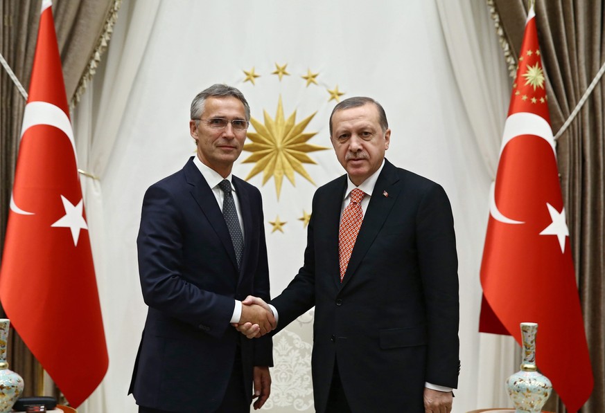 epa05530840 A handout picture provided by Turkish Presidential Press Office shows NATO Secretary General Stoltenberg (L) and Turkish President Recep Tayyip Erdogan pose before their meeting in Ankara, ...