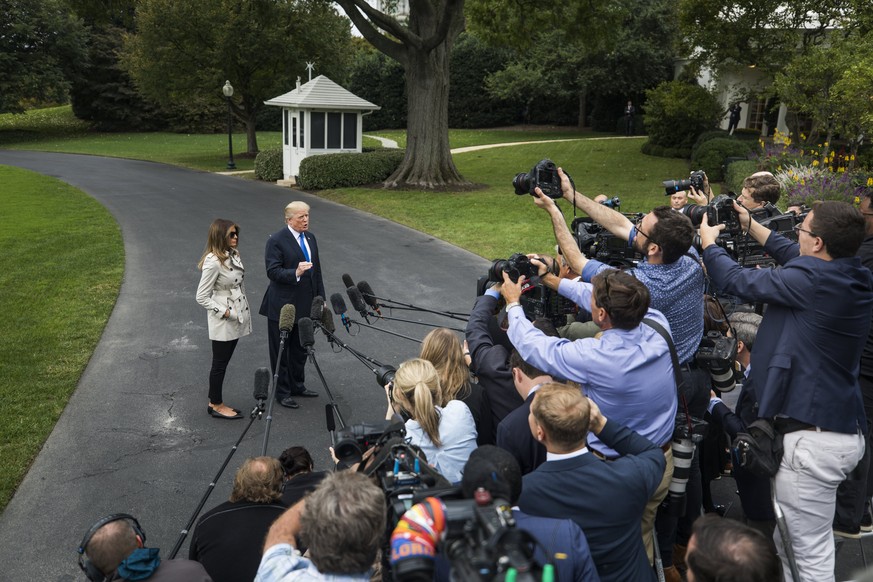 epa06264060 US President Donald J. Trump, standing alongside US First Lady Melania Trump, answers reporter&#039;s questions about his decision to withdraw presidential certification of the Iran nuclea ...