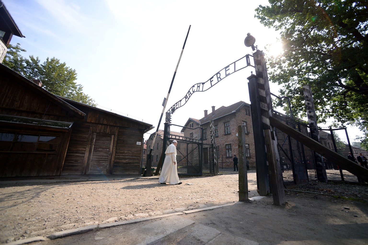 Pope Francis walks through Auschwitz&#039;s notorious gate with the sign &quot;Arbeit Macht Frei&quot; (Work sets you free) during his visit to the former Nazi death camp, Poland, July 29, 2016. REUTE ...