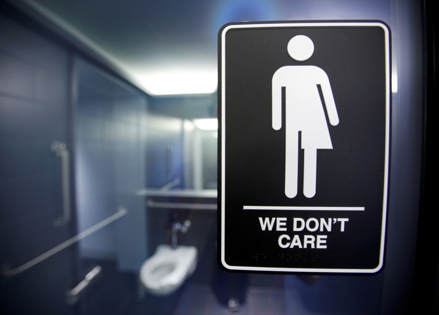 A sign protesting a recent North Carolina law restricting transgender bathroom access adorns the bathroom stalls at the 21C Museum Hotel in Durham, North Carolina May 3, 2016. REUTERS/Jonathan Drake/F ...