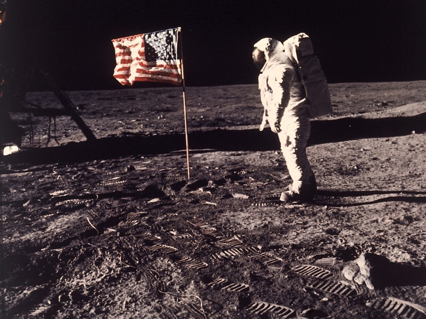 FILE - A July 20, 1969 photo from files made showing astronaut Edwin E. &quot;Buzz&quot; Aldrin Jr. posing for a photograph beside the U.S. flag deployed on the moon during the Apollo 11 mission. A pr ...