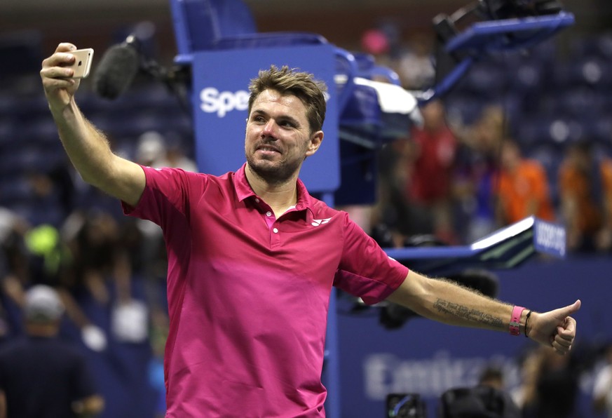 Stan Wawrinka, of Switzerland, takes a selfie after beating Novak Djokovic, of Serbia, to win the men&#039;s singles final of the U.S. Open tennis tournament, Sunday, Sept. 11, 2016, in New York. (AP  ...