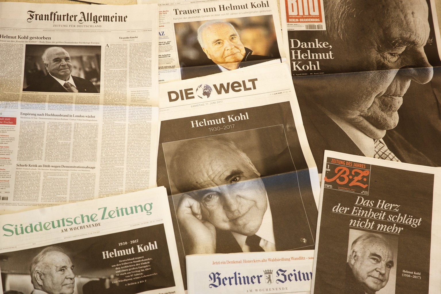 epa06032560 German newspapers show former German Chancellor Helmut Kohl on their front pages, the day after his death was announced, Berlin, Germany, 16 June 2017. Helmut Kohl was the sixth Federal Ch ...