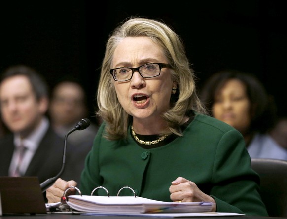 FILE - This Jan. 23, 2013 file photo shows then-Secretary of State Hillary Rodham Clinton testifying on Capitol Hill in Washington before the Senate Foreign Relations Committee hearing on the deadly S ...
